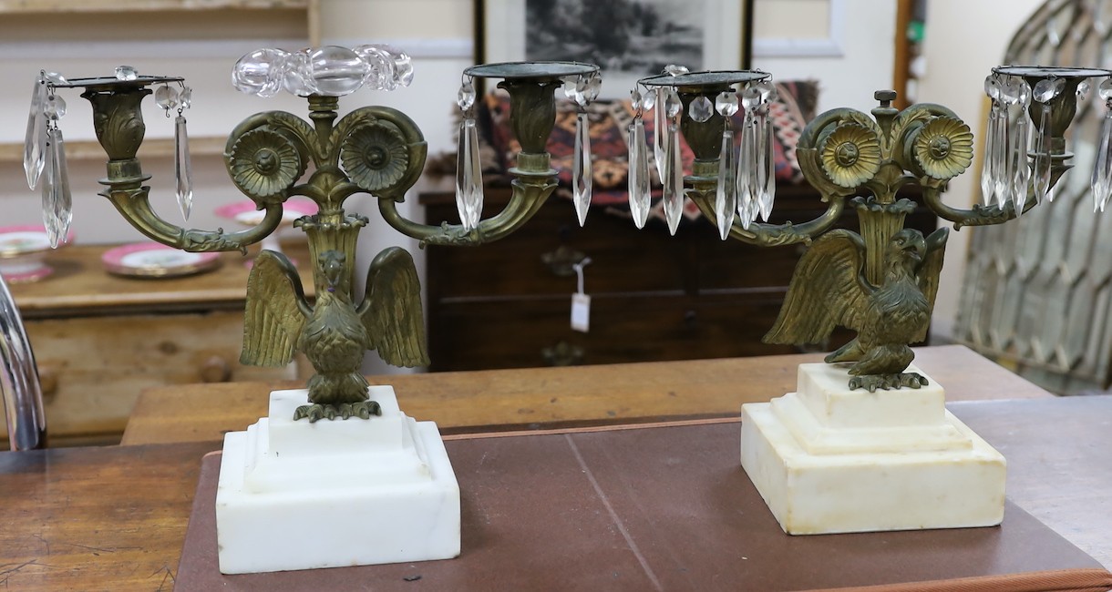 A pair of 19th century eagle two branch candelabra, 34cms high x 3cms wide